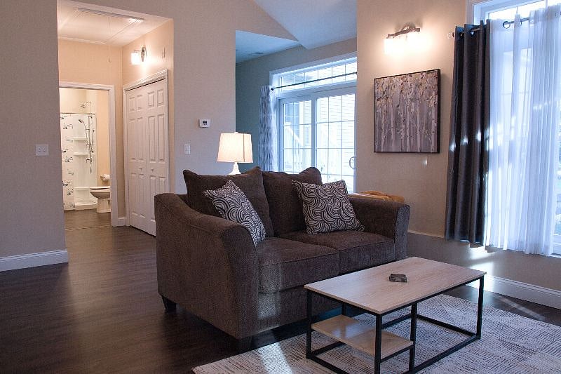 Living room to hall leading to bath and bedroom