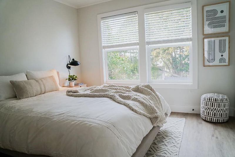 Queen bed. Laundry hampers in closet.