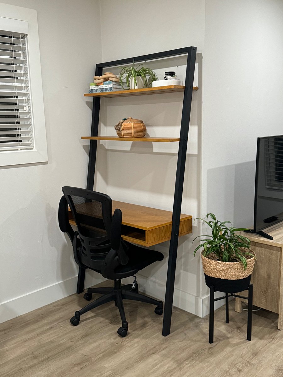 Desk with 38 inch work surface and office chair can be provided in place of the decorative shelf to accommodate work from home needs.