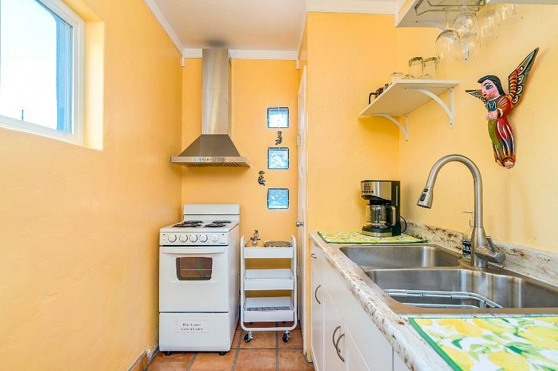Kitchen with 4 burner stove, oven & full-sized fridge