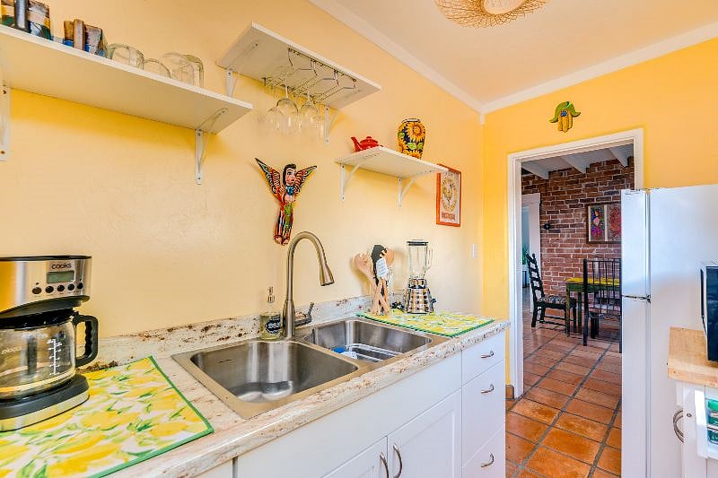 Kitchen with 4 burner stove, oven & full-sized fridge