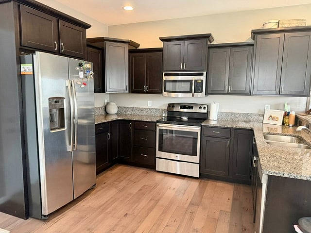 Full kitchen with dishwasher.