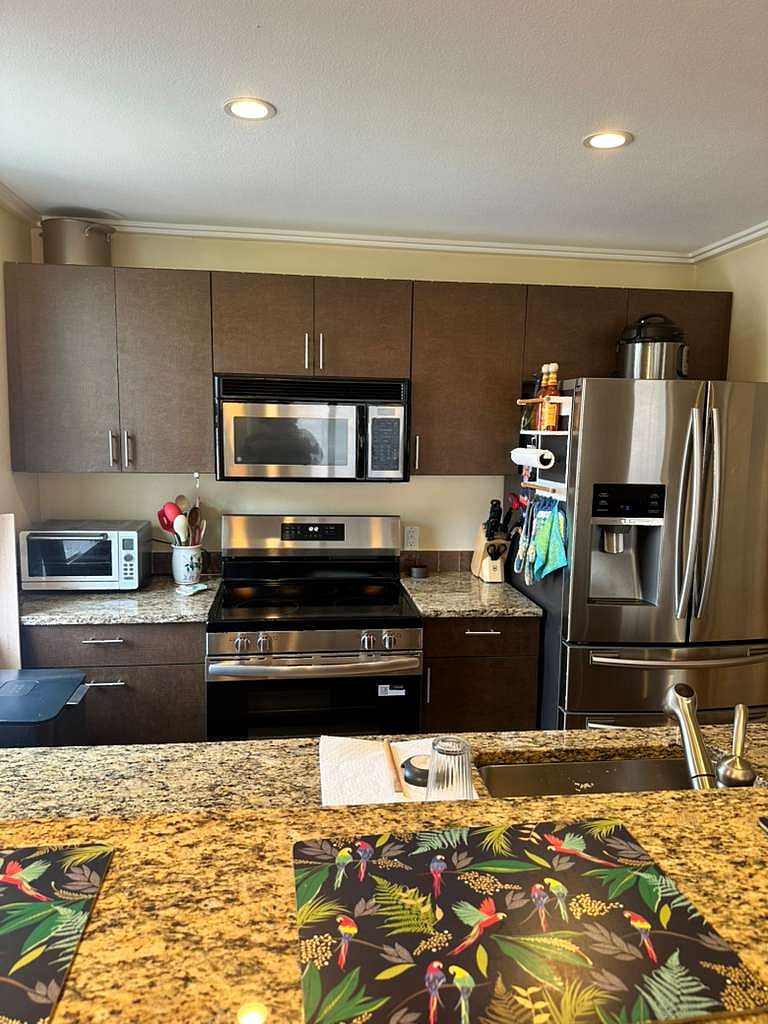Kitchen with new stainless steel appliances