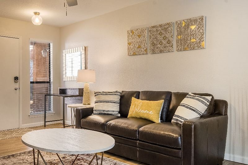 Beautifully decorated living room with 100 percent leather sofa for a relaxing evening after a long hard day.