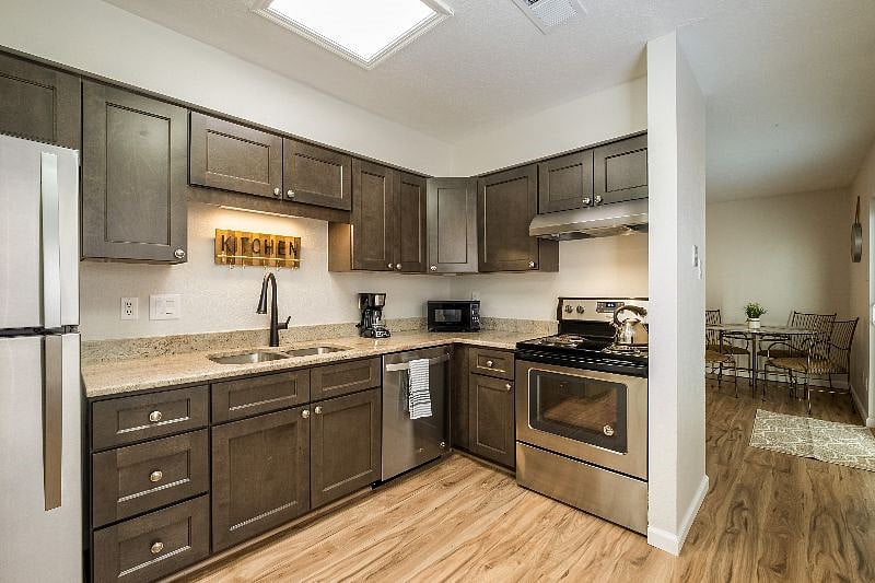 Beautiful kitchen stocked with all things needed for cooking or hosting guests.