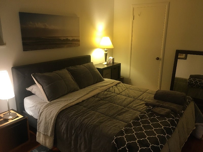 Bedroom 2 with two closets and queen size bed nighttime