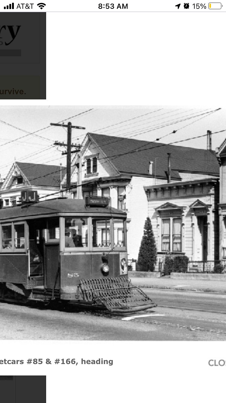 The Victorian house circa 1948 with the old style tram going by... now replaced with a modern light rail.