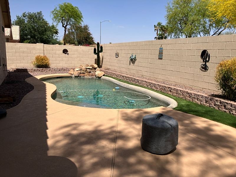 5' deep pebbletec pool with 2 lounge chairs and patio seating for 8. Plenty of sun AND shade