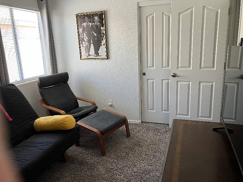 Private Living room with a leather chair and ottoman