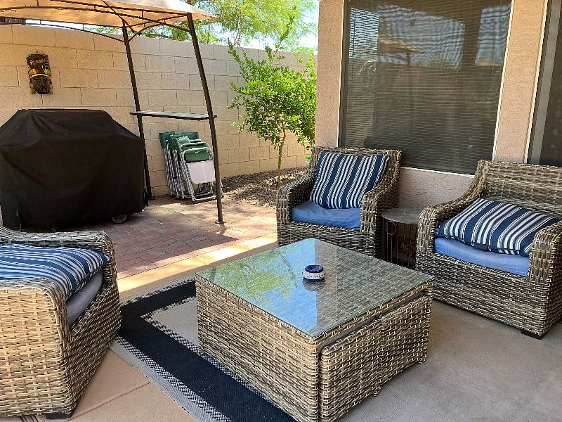 Covered patio with mister and ceiling fan. Seating for 4