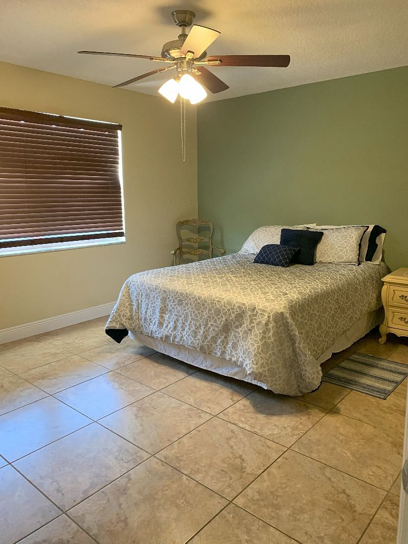 Second bedroom has a queen size be, 6 drawer dresser, bedside table and a walk-in closet