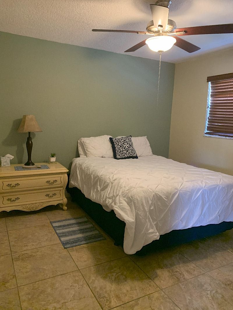Main bedroom has Queen size bed, 6 drawer dresser, bedside table and walk-in closet.