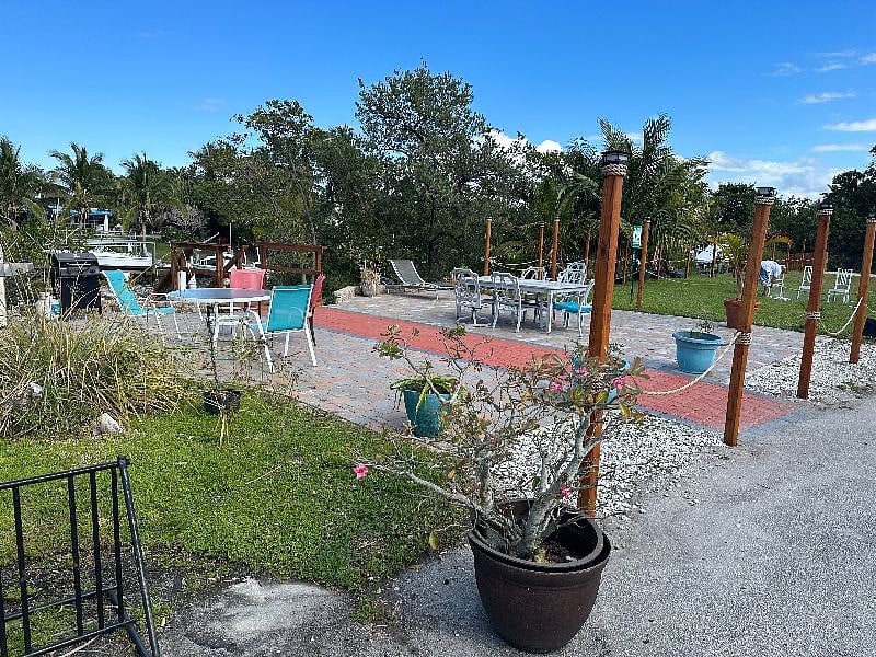 Patio area provides ample amount of seating as well as a gas grills for cooking.