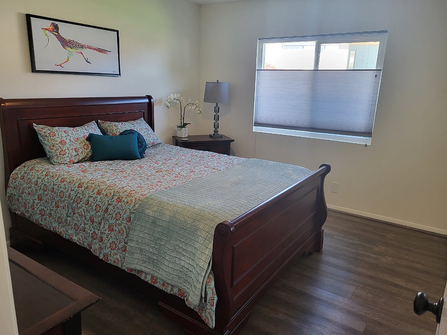 Queen bed with bathroom across hall