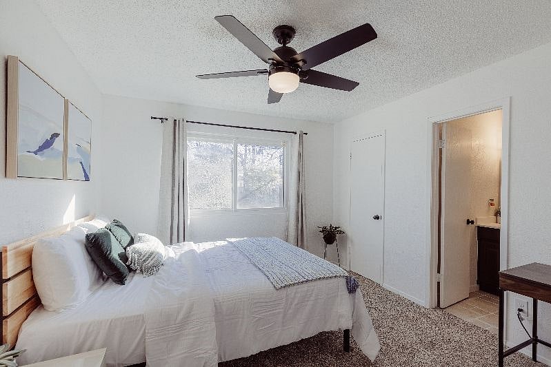 Master bedroom with private bathroom and office desk