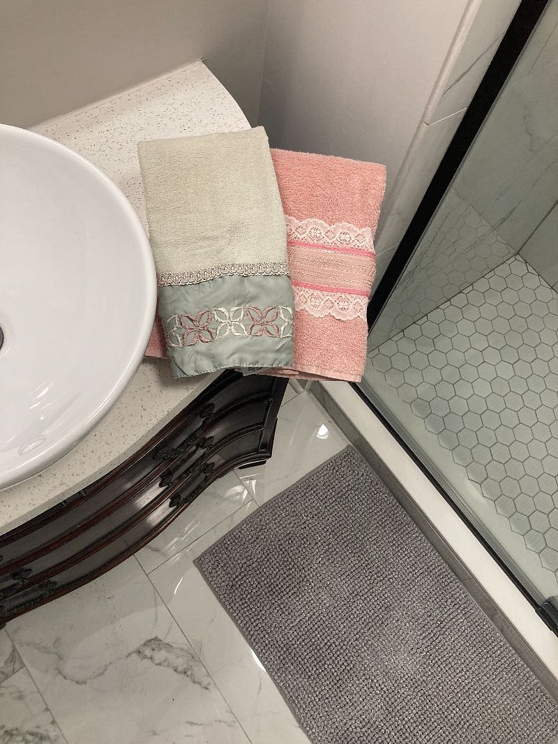 Tiled flooring, walls invoke a spa-atmosphere.