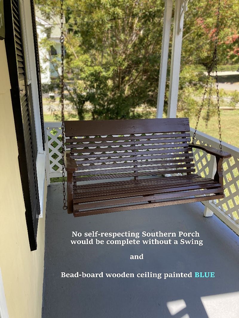No southern porch would be complete without a porch swing and bead board wood ceiling painted blue!