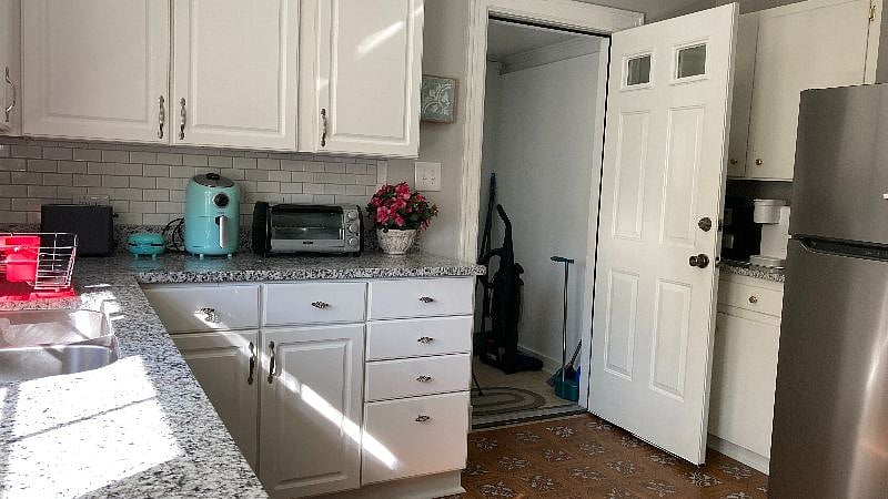 Kitchen has a door that has a dead-bolt lock leading to the laundry room. Cleaning supplies, Washer/Dryer located here. Room not heated/cooled. You can leave the door open when doing laundry and lock at other times.