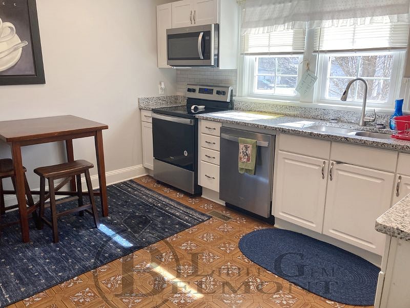 Lots of sunshine in this full-sized kitchen from the South Facing new windows!