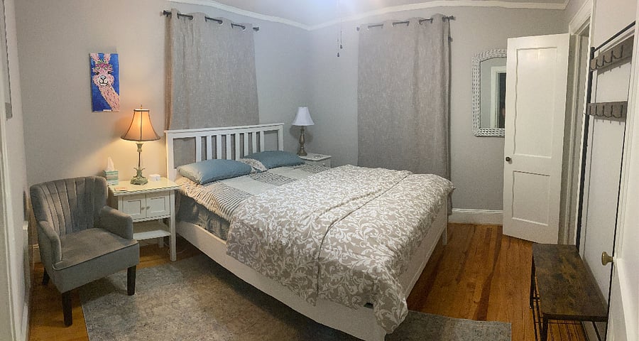 Primary Sleeping Room

The main sleeping room is thoughtfully set up for traveling professionals who need quiet, restful sleep between shifts. Located in the back of the home, this room features north-facing windows with blackout curtains to keep the space cool, dark, and ideal for daytime sleeping.

The room includes a comfortable queen bed, nightstand, and closet, and is conveniently located next to the bathroom.

We intentionally chose this rear bedroom as the primary sleeping space because it is the quietest room in the house. The brighter bedroom at the front of the homewith its afternoon south-facing windowsis perfect if you have an occasional overnight guest or visiting family member, allowing the primary sleeper to keep their peaceful retreat in the back of the home.

This setup helps maintain a restful environment for medical professionals working varying shifts. 