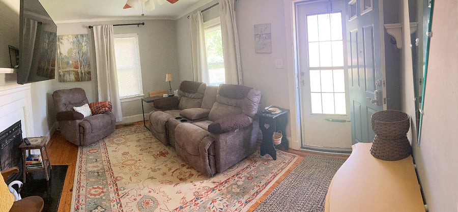 Bright & cherry living room with 2 windows and a storm door for more lighting