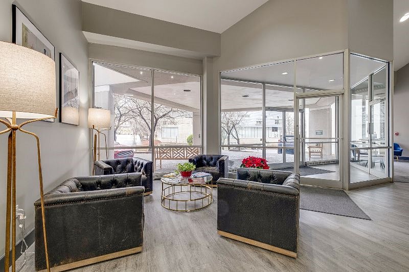 Stylish lobby with secured entrance; multiple elevators; doorman