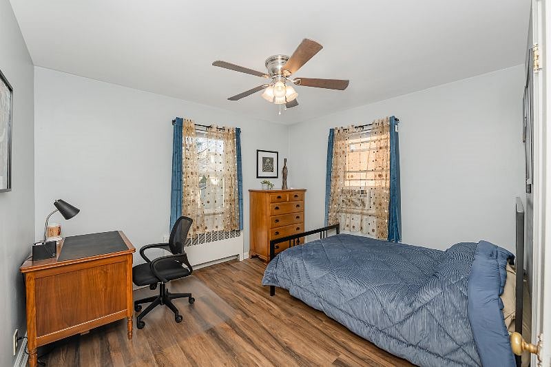 Bedroom 2 features a full bed and work area