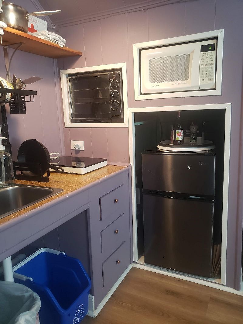 This is a KITCHENETTE. with broiler/toaster oven (large enough for a pizza or a chicken roast), singlet hot plate and microwave for cooking. Small sink. All cooking essentials and some spices and oils provided. Please replace for the next guest if you use it up.