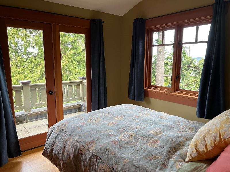 View from bedroom to one of your private decks accessed through french doors.