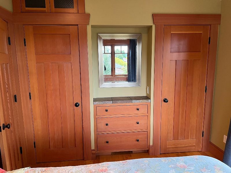 View of 2 closets next to the bed.