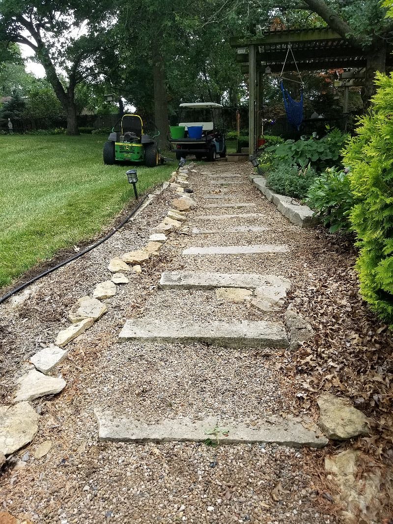Backyard sidewalk, being rerouted due to tree growth.