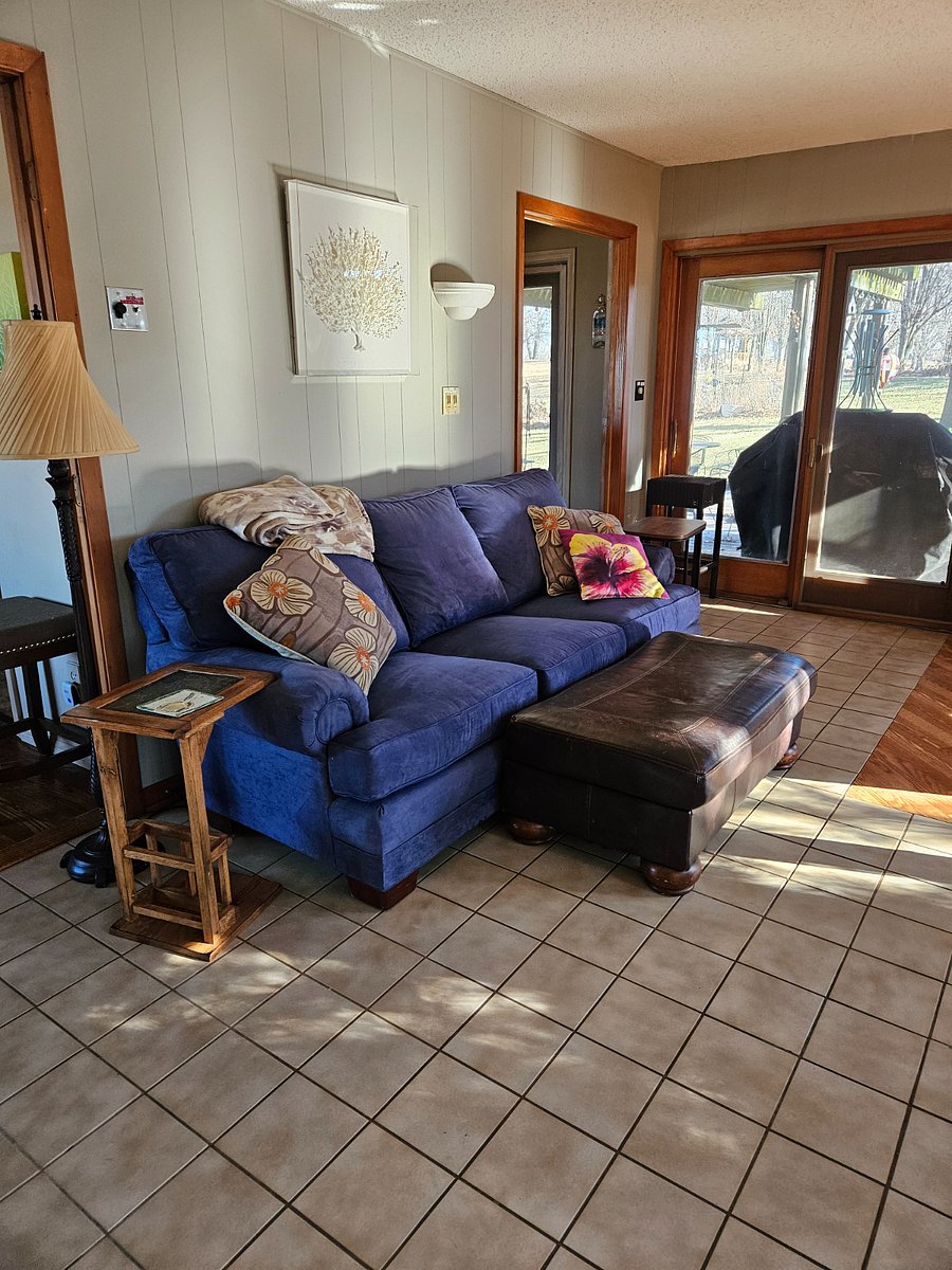 Living room. Shows a gas grill outside.