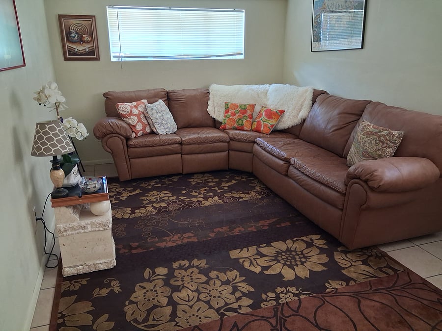 Den with lovely leather couch and queen size pull out bed.