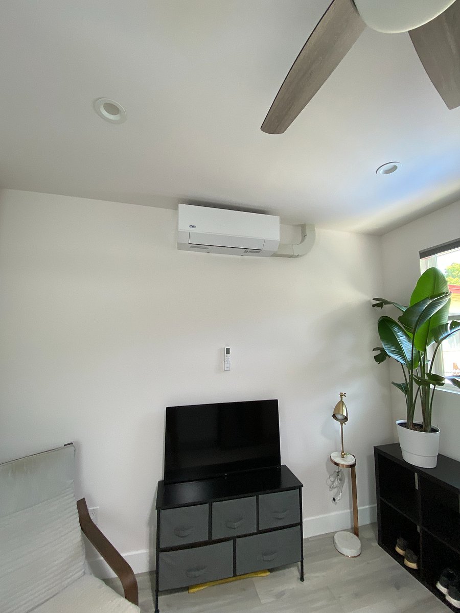 Living room with TV and HVAC.
