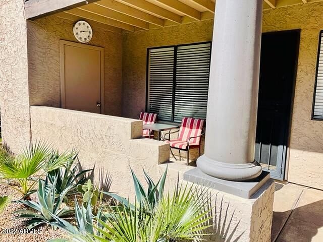 Nice patio seating and steps from the pool!