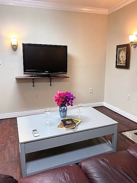 Lift up coffee table raises outward and can be used as a desk or table for eating