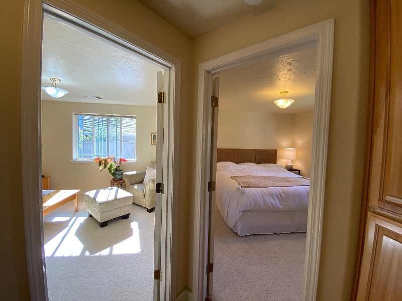 The hallway opens into the bedroom, living area and bathroom.