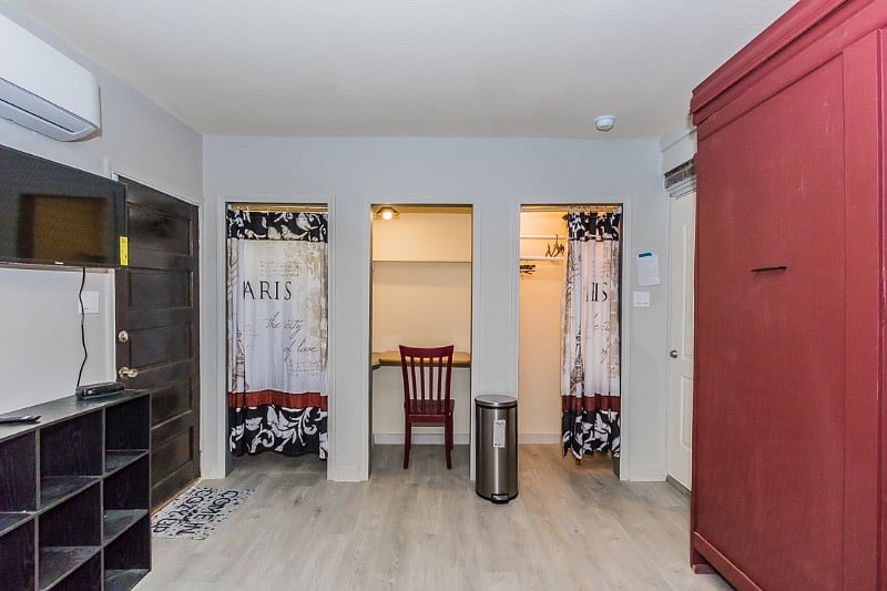 With the bed tucked away the space is big enough for all of your yoga stretching. 