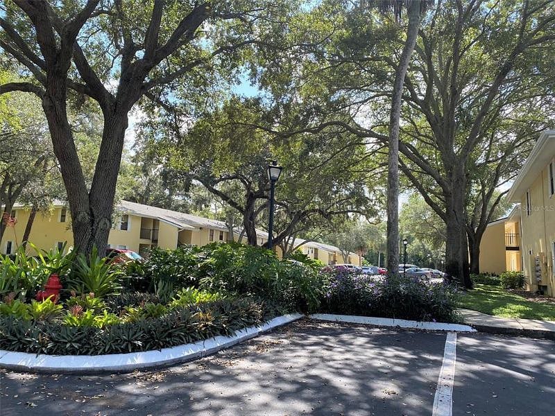 Lush tropical landscape and live oaks provide shade and a pretty setting
