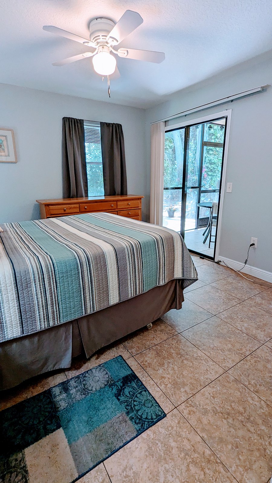 Master bedroom with sliding door access to the lanai
