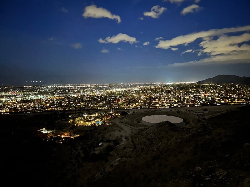 Walk out your door and go on an evening hike w head lamps to see the city.