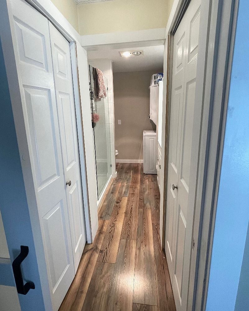 Downstairs closet space (left) leading into the bathroom.
