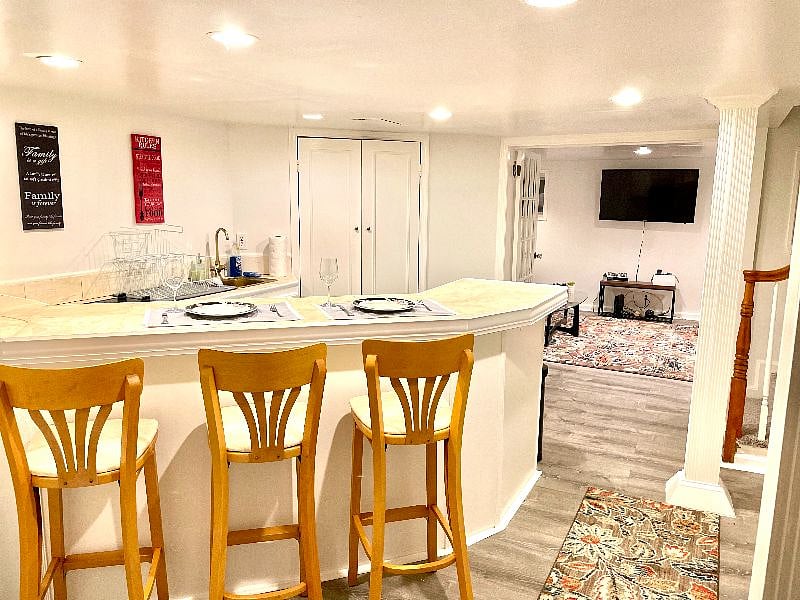 Spacious living room and kitchen area separated by 2 glass doors which can be opened and closed.