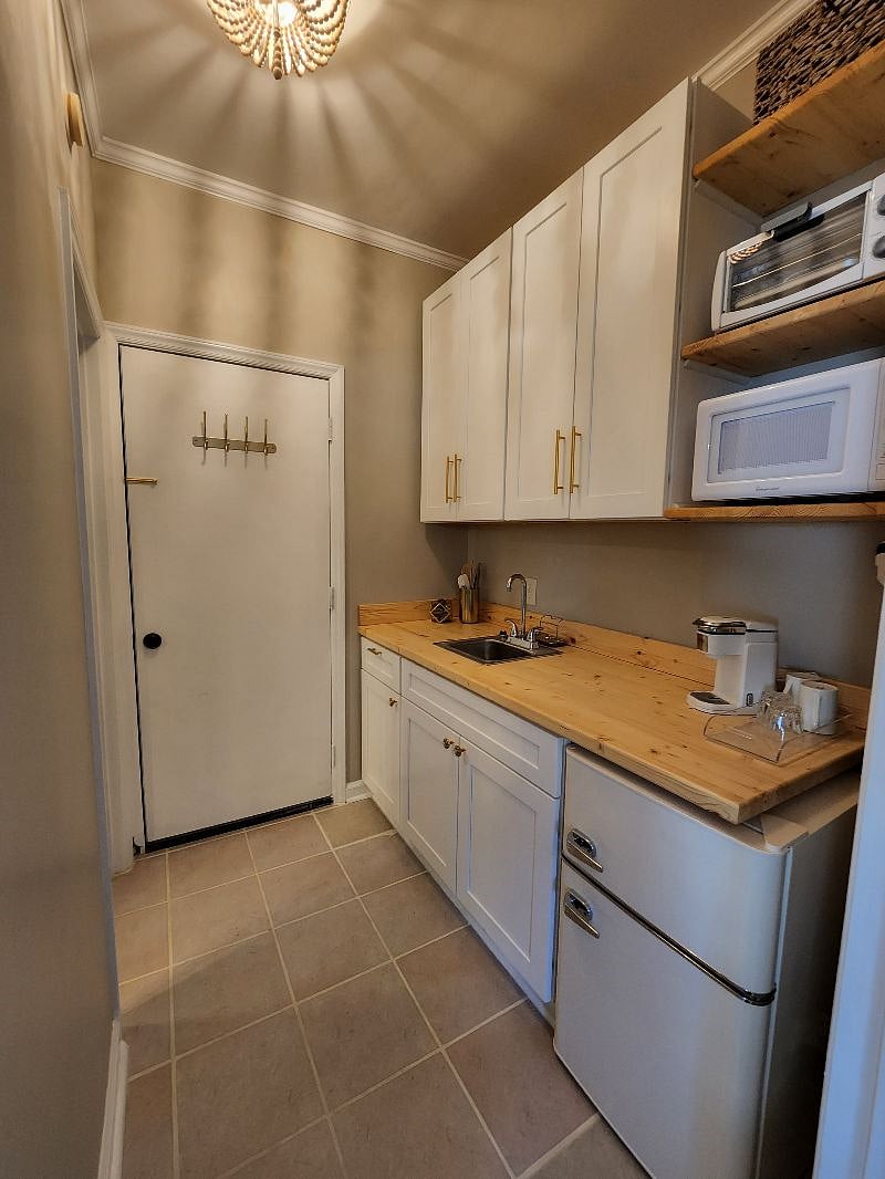 Microwave, toaster oven, single eye hot plate, air fryer, Keurig, and mini fridge