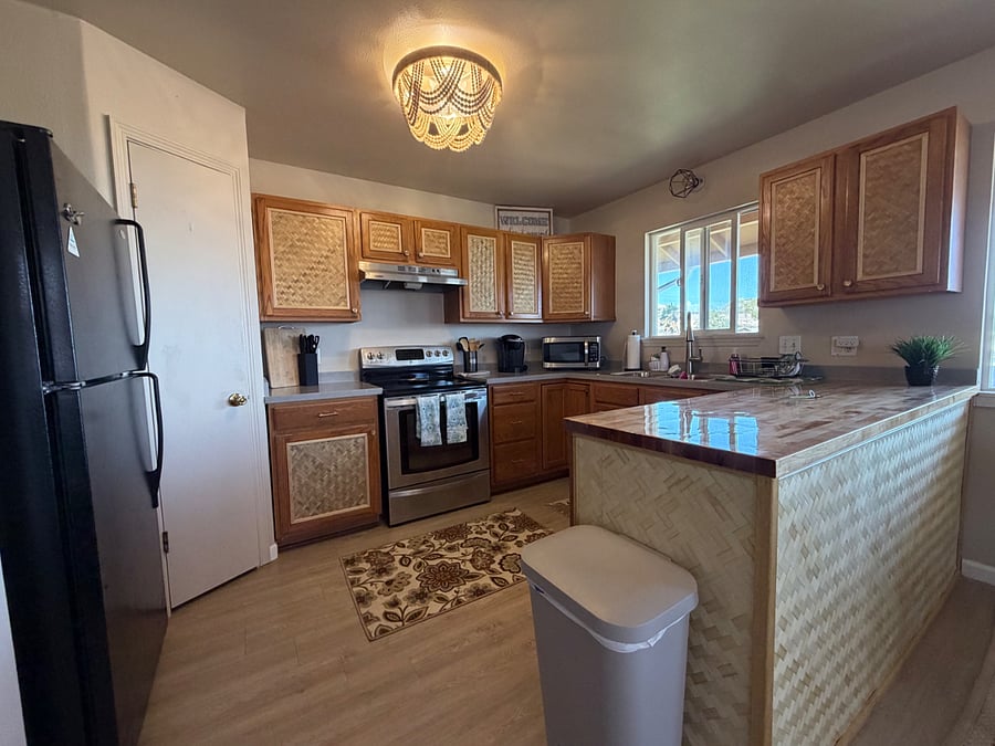 Brand new kitchen renovation.  New sink, countertops and custom cabinets!  Island Vibes!