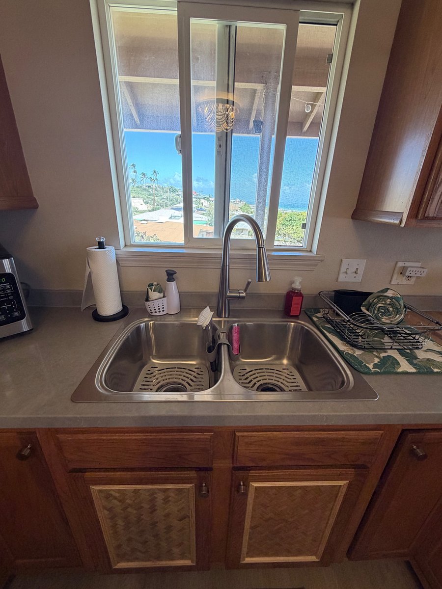 Brand new kitchen renovation.  New sink, countertops and custom cabinets!  Island Vibes!