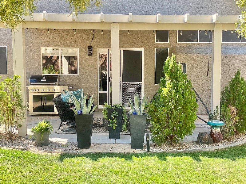 Backyard with Patio Furniture and Grill 