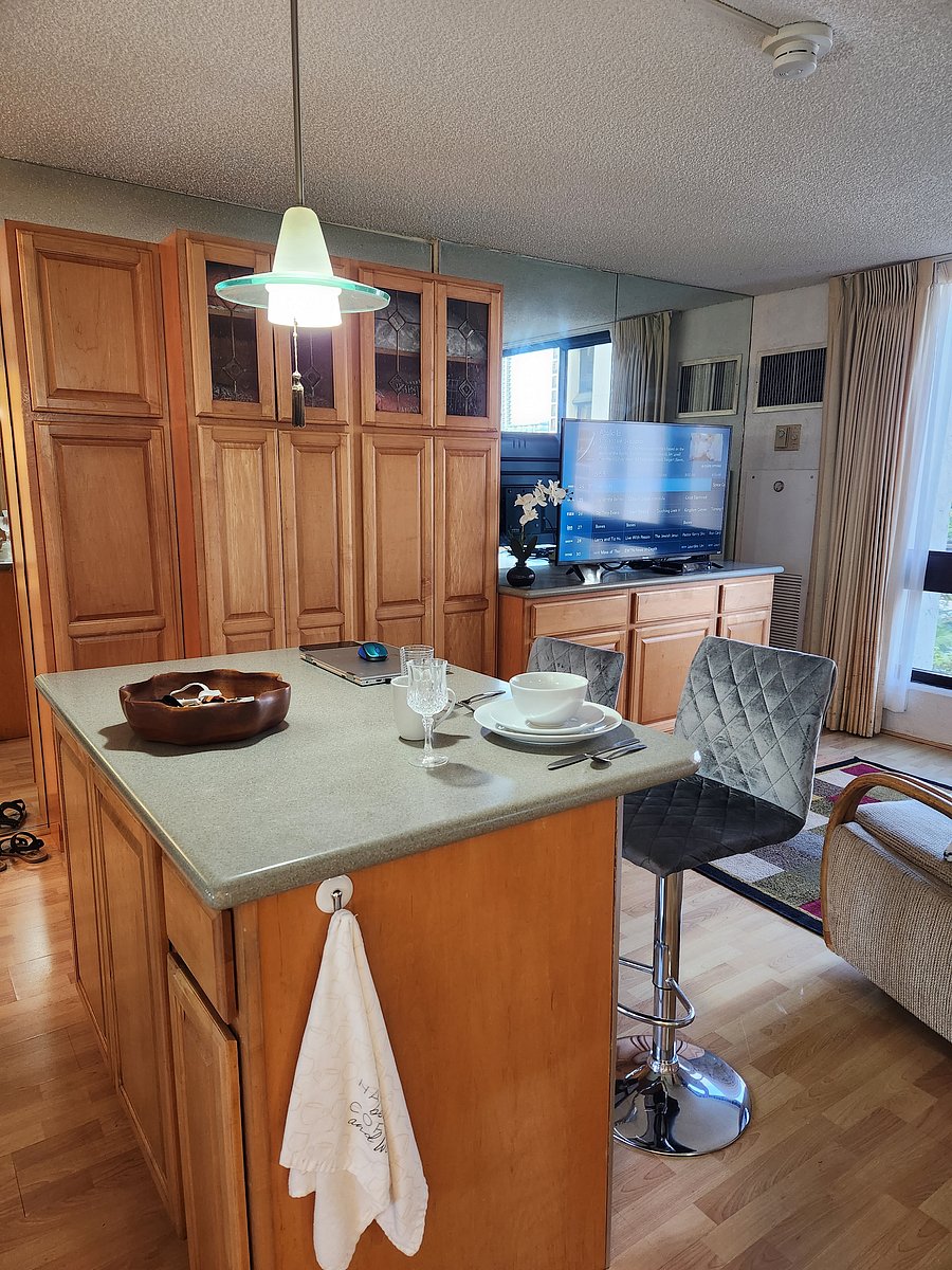 Kitchen Island, closet and storage cabinets, drawers, and television with WiFi.