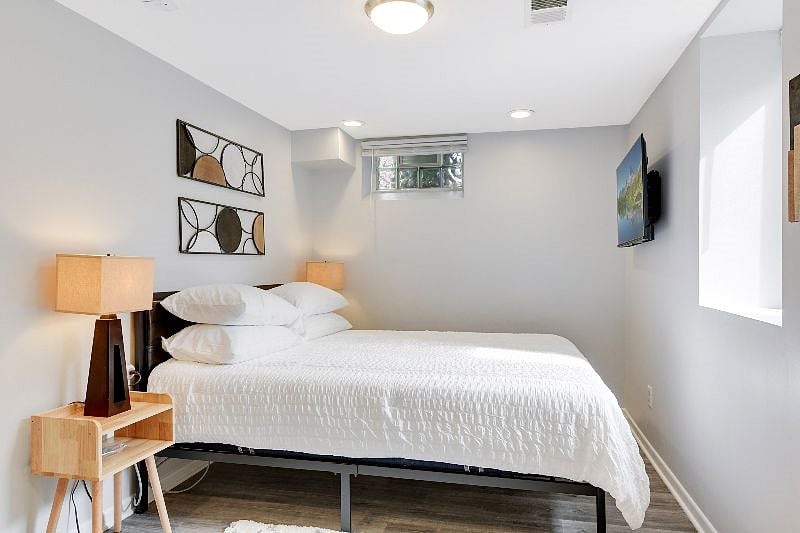 Lower level bedroom is a completely private and large room on its own level with a private bath and a QUEEN-sized bed, sitting chair, smart TV and large closet with an organizer system for all of your needs.