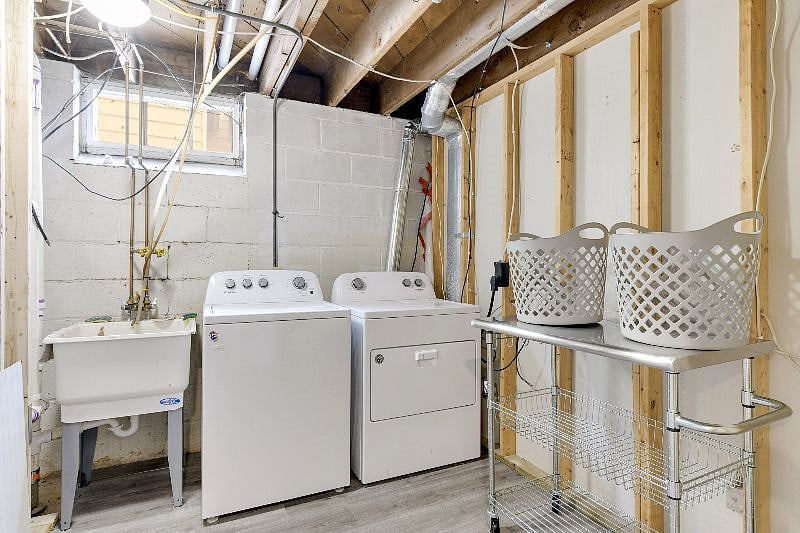 Lower-level laundry with brand new washer, dryer. Hanging racks, baskets and detergent supplied.